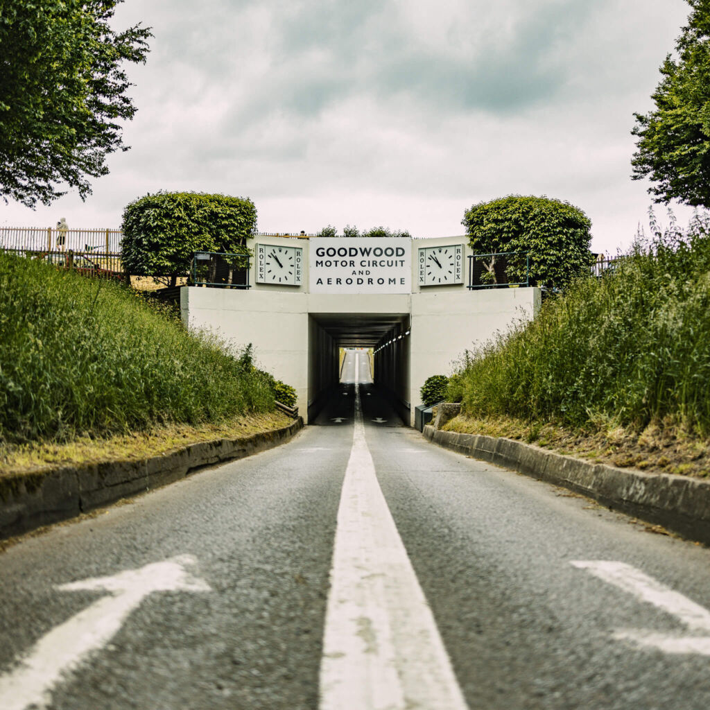Low-angle shot of the iconic track entrance lane at Goodwood Motor Circuit in the United Kingdom